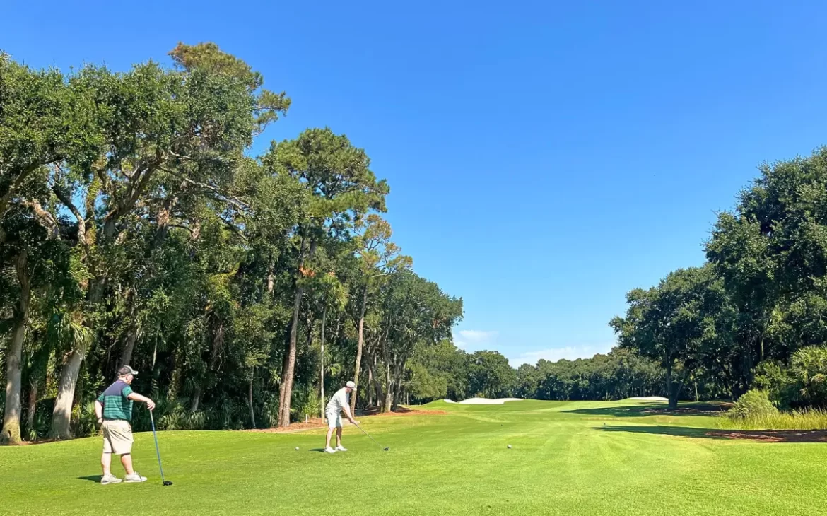 One player about to drive with the other watching on one of the more secluded holes at Cougar Point golf course