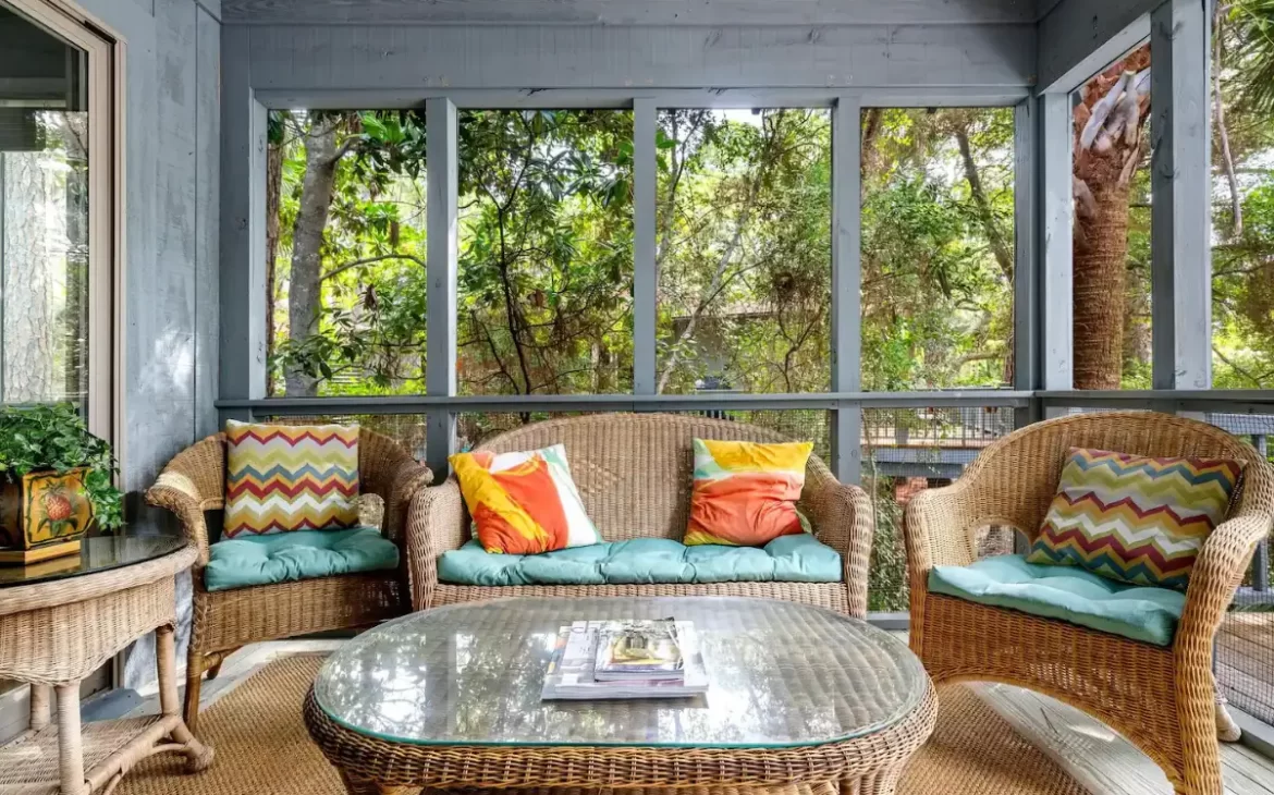 Brightly colored screened-in porch in a coastal Airbnb