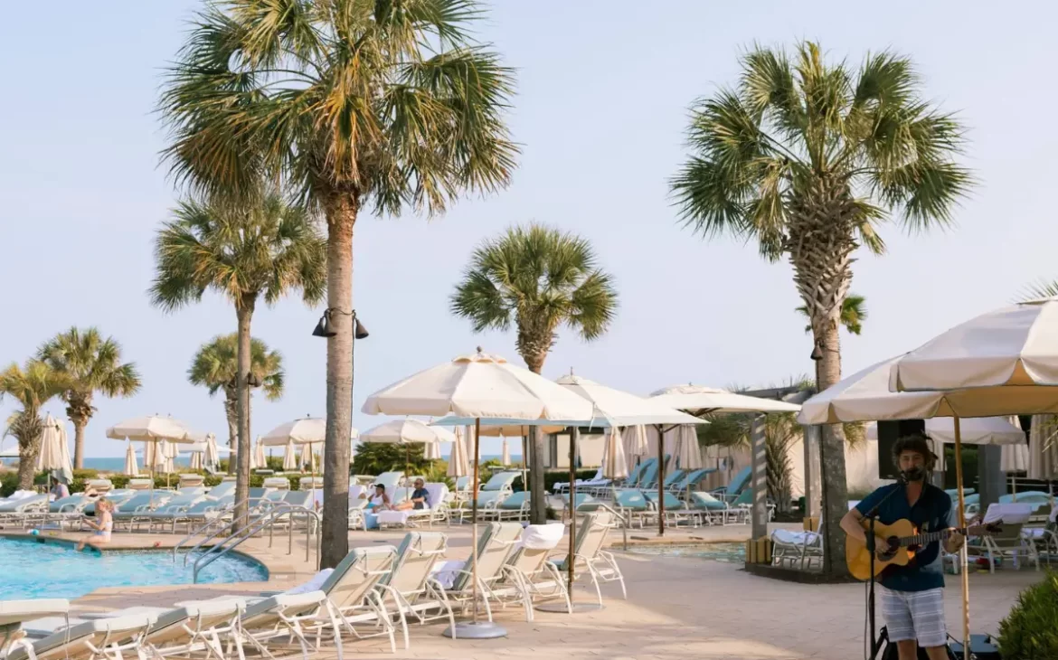 A sunny and serene pool deck at the Sanctuary resort